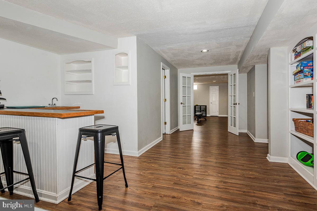 1665 Patrice Circle Crofton, MD 21114 - Photo 37 of 55 a view of a hallway with wooden floor and furniture