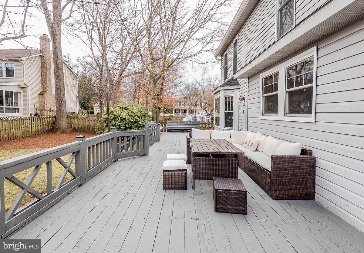1665 Patrice Circle Crofton, MD 21114 - Photo 45 of 55 a view of a deck with couches wooden floor and fence