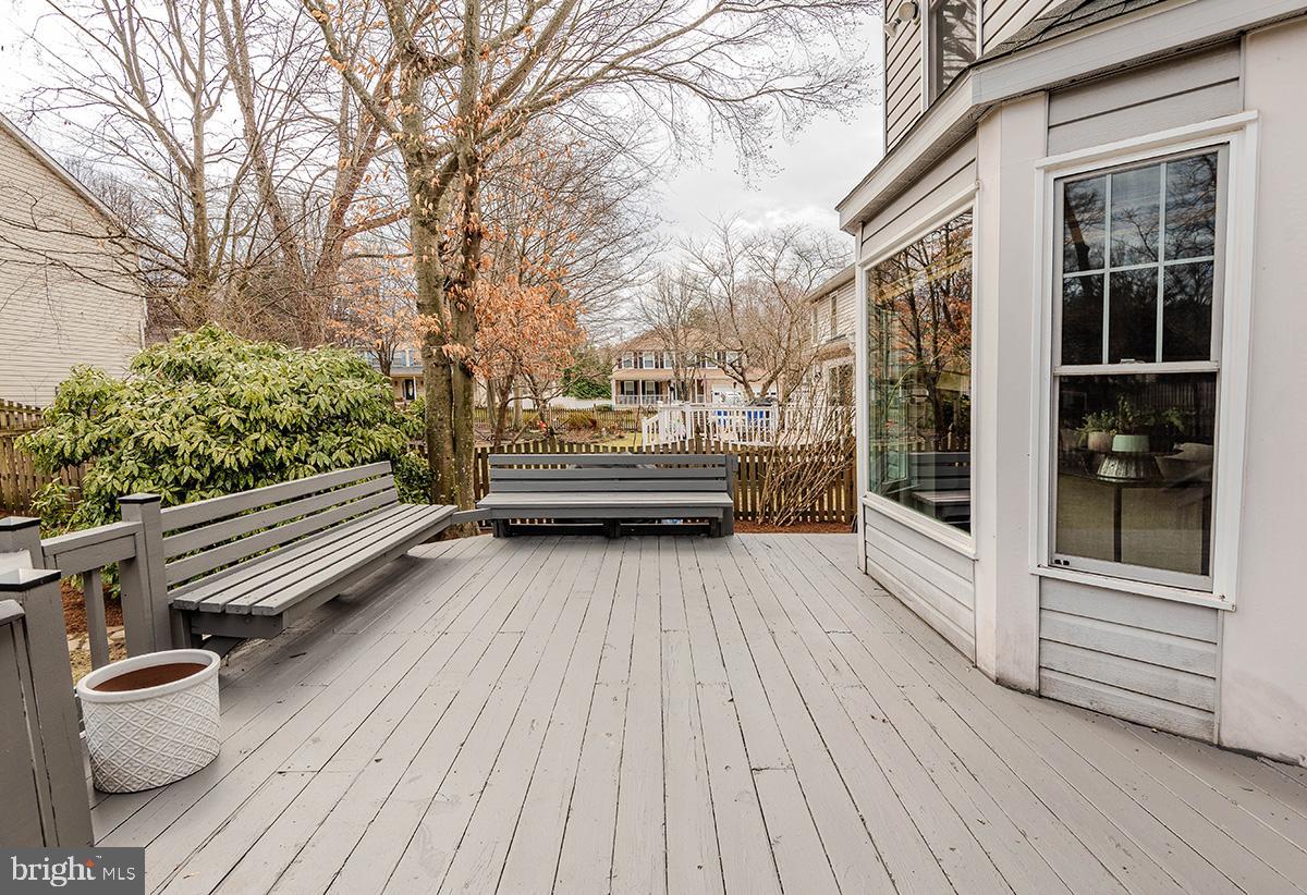 1665 Patrice Circle Crofton, MD 21114 - Photo 48 of 55 a view of a wooden deck with a bench
