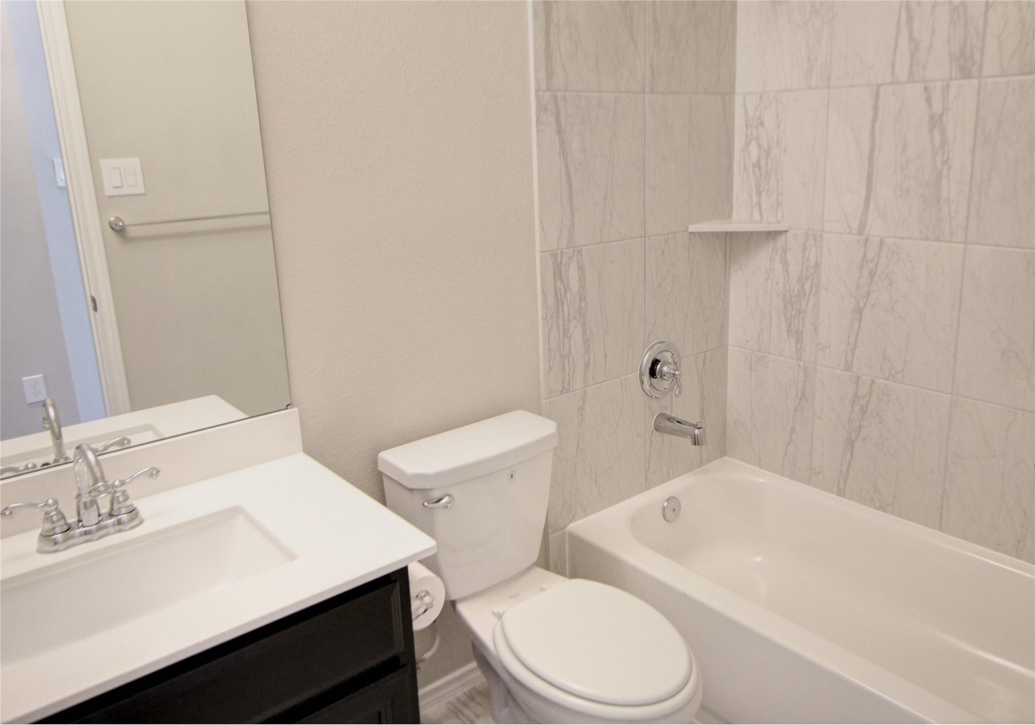 523 Timber Voyage Court Conroe, TX 77304 - Photo 12 of 20 a white toilet sitting next to a bathroom sink