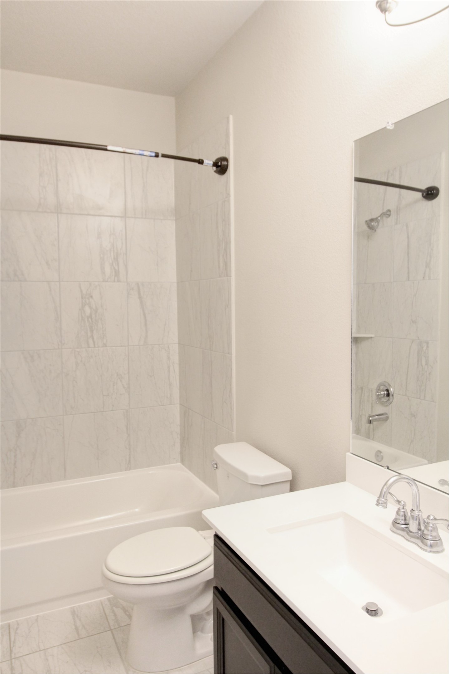 523 Timber Voyage Court Conroe, TX 77304 - Photo 19 of 20 a bathroom with a sink a toilet and a bathtub