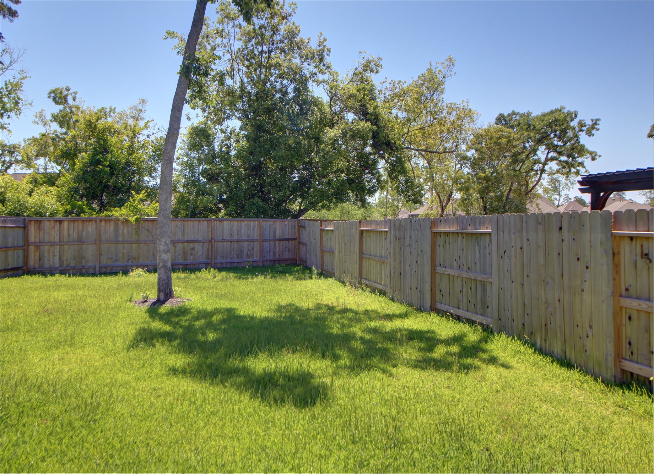523 Timber Voyage Court Conroe, TX 77304 - Photo 20 of 20 a view of outdoor space and yard with wooden fence