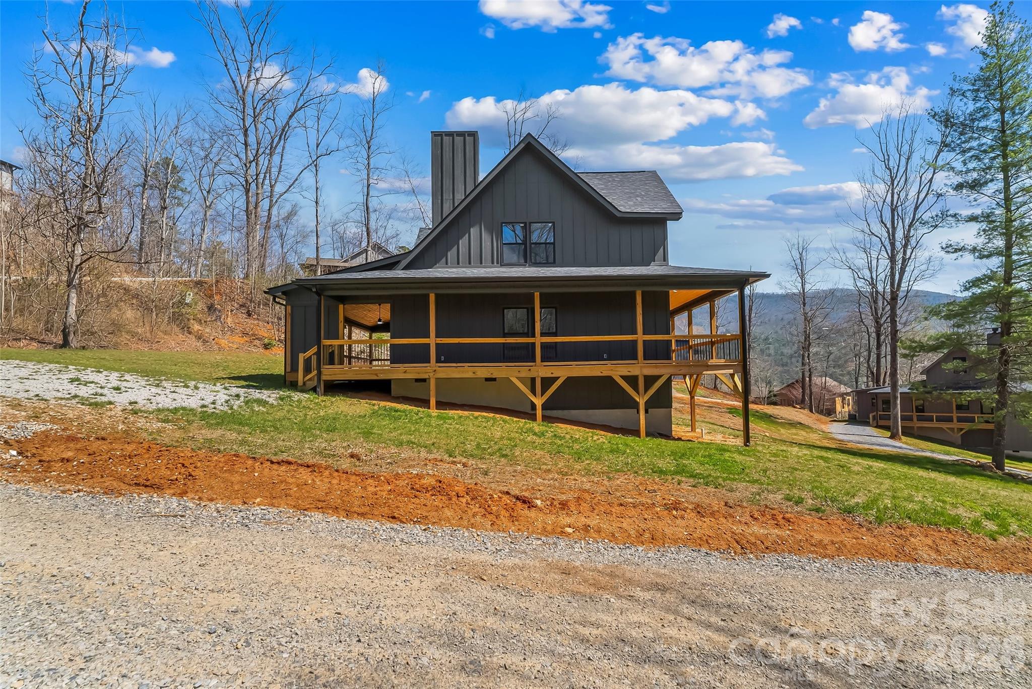 189 Clinchfield Gap Road Marion, NC 28752 - Photo 12 of 42 a view of a house with a yard porch and sitting area