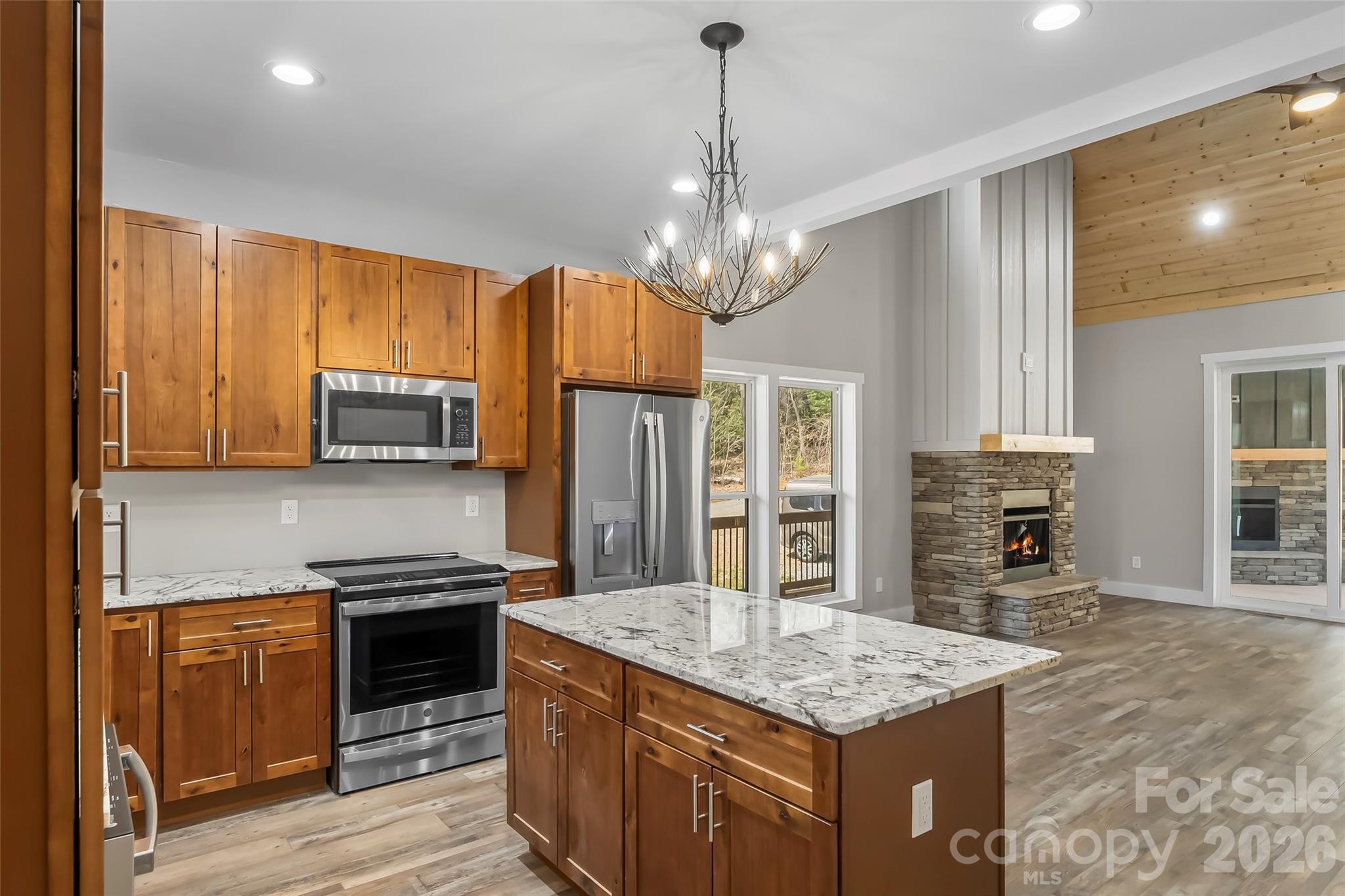 189 Clinchfield Gap Road Marion, NC 28752 - Photo 16 of 42 a kitchen with stainless steel appliances granite countertop a sink stove and refrigerator