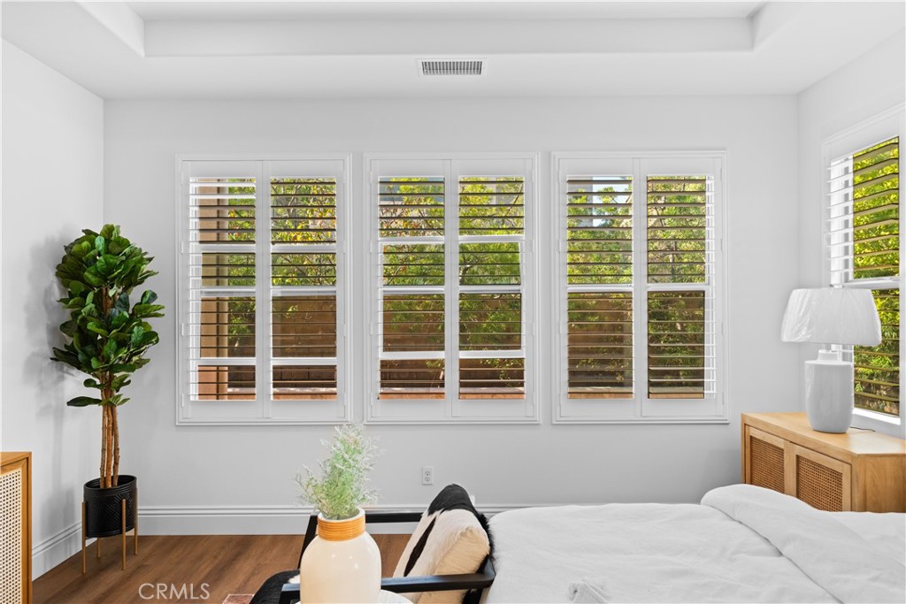 18 Windrow Road Tustin, CA 92782 - Photo 13 of 35 a bedroom with furniture and a window