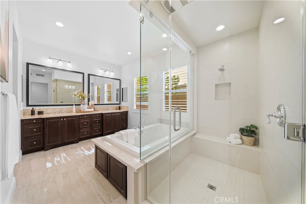 18 Windrow Road Tustin, CA 92782 - Photo 15 of 35 a large bathroom with a tub double sink shower and mirror