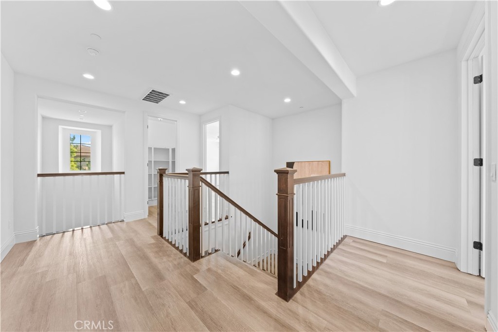 18 Windrow Road Tustin, CA 92782 - Photo 19 of 35 a view of a hallway with wooden floor and stairs
