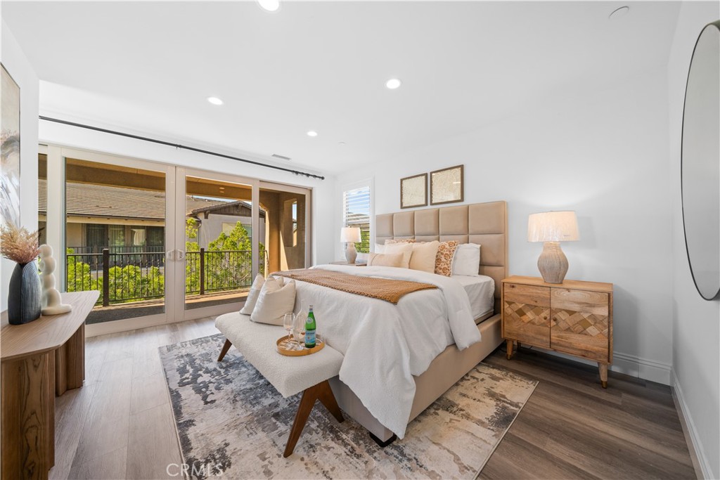 18 Windrow Road Tustin, CA 92782 - Photo 20 of 35 a bedroom with a bed and glass window