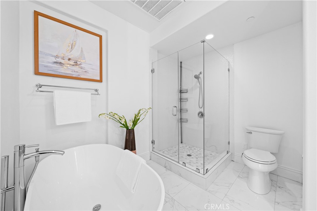 18 Windrow Road Tustin, CA 92782 - Photo 25 of 35 a bathroom with a shower a toilet and a shower