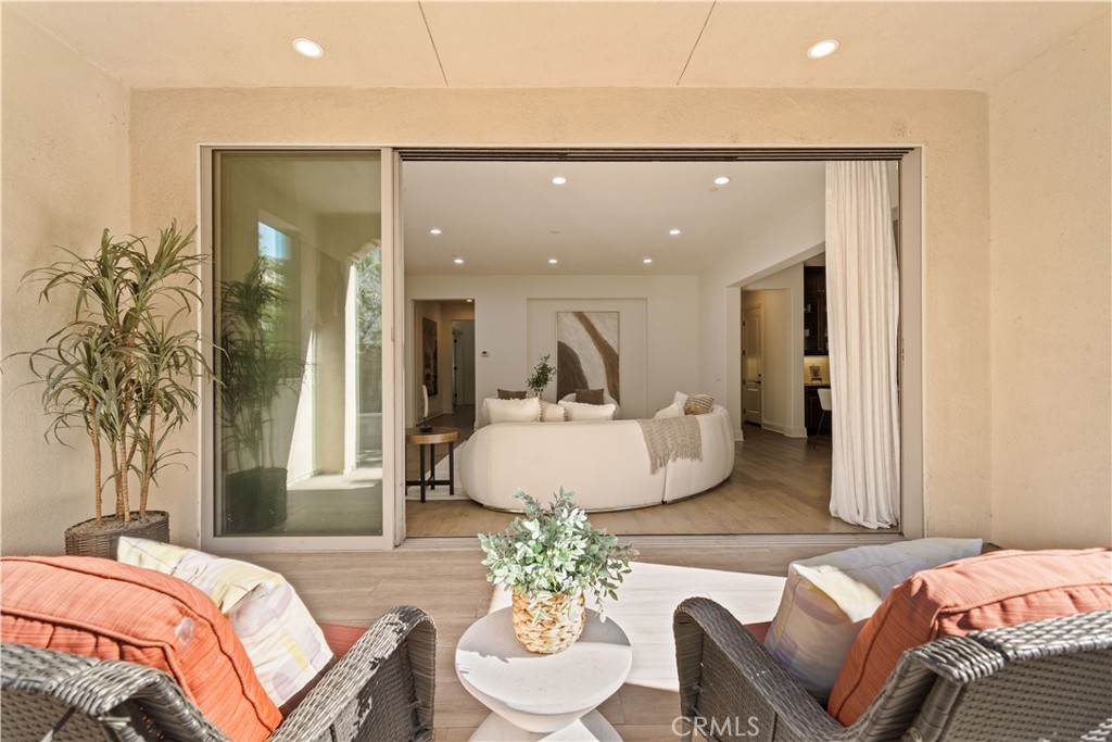 18 Windrow Road Tustin, CA 92782 - Photo 28 of 35 a living room with a couch and a potted plant