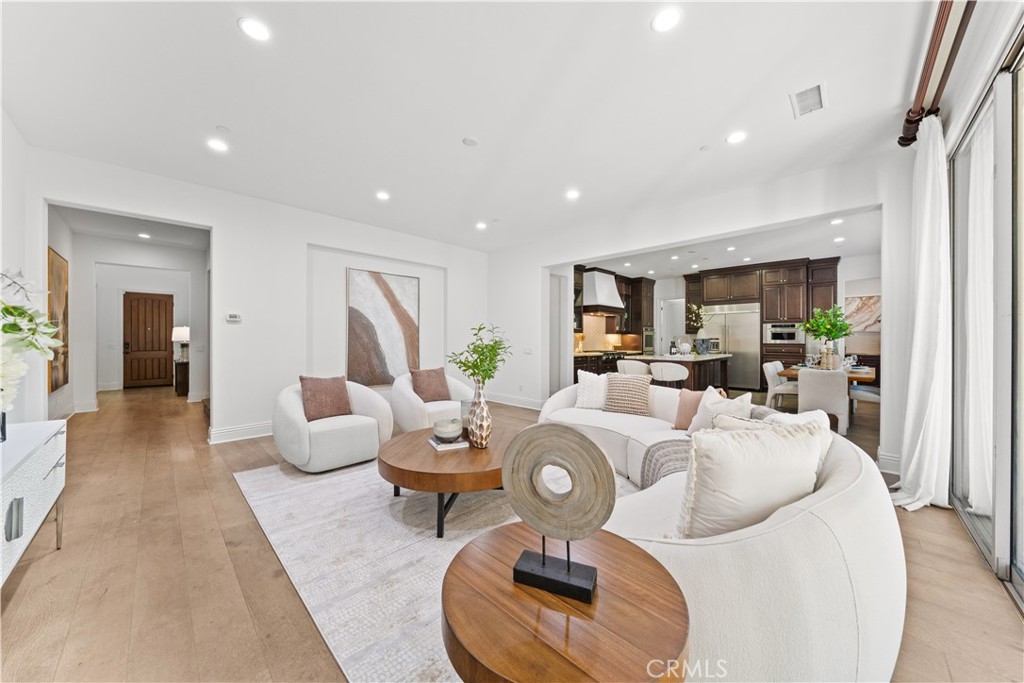 18 Windrow Road Tustin, CA 92782 - Photo 3 of 35 a living room with furniture and a wooden floor