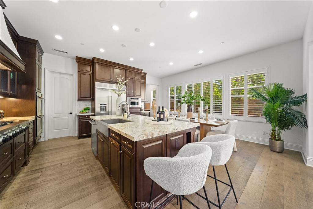 18 Windrow Road Tustin, CA 92782 - Photo 7 of 35 a large kitchen with kitchen island a large island in it