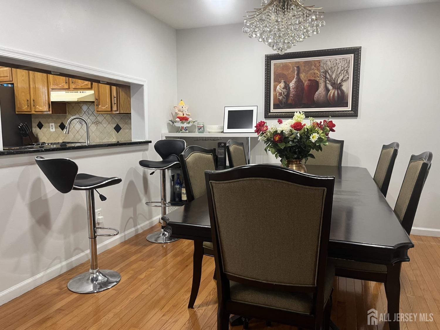 1505 Timber Oaks Road Edison, NJ 08820 - Photo 11 of 27 a view of a dining room with furniture and wooden floor