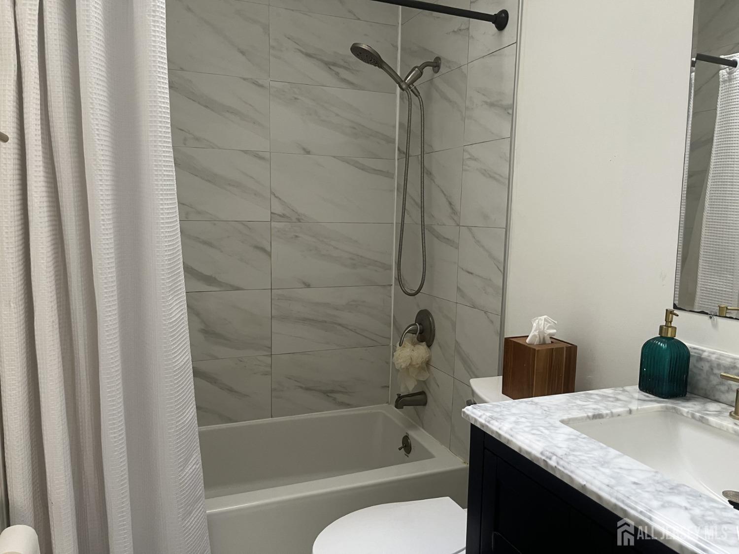 1505 Timber Oaks Road Edison, NJ 08820 - Photo 12 of 27 a bathroom with a granite countertop sink toilet and shower