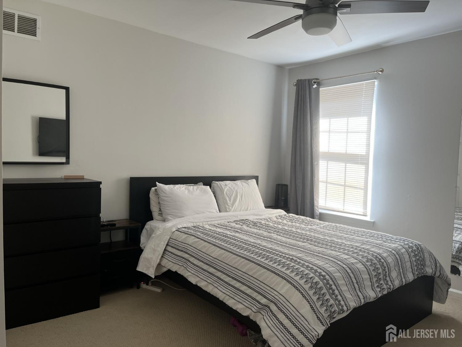 1505 Timber Oaks Road Edison, NJ 08820 - Photo 18 of 27 a bedroom with a bed and window