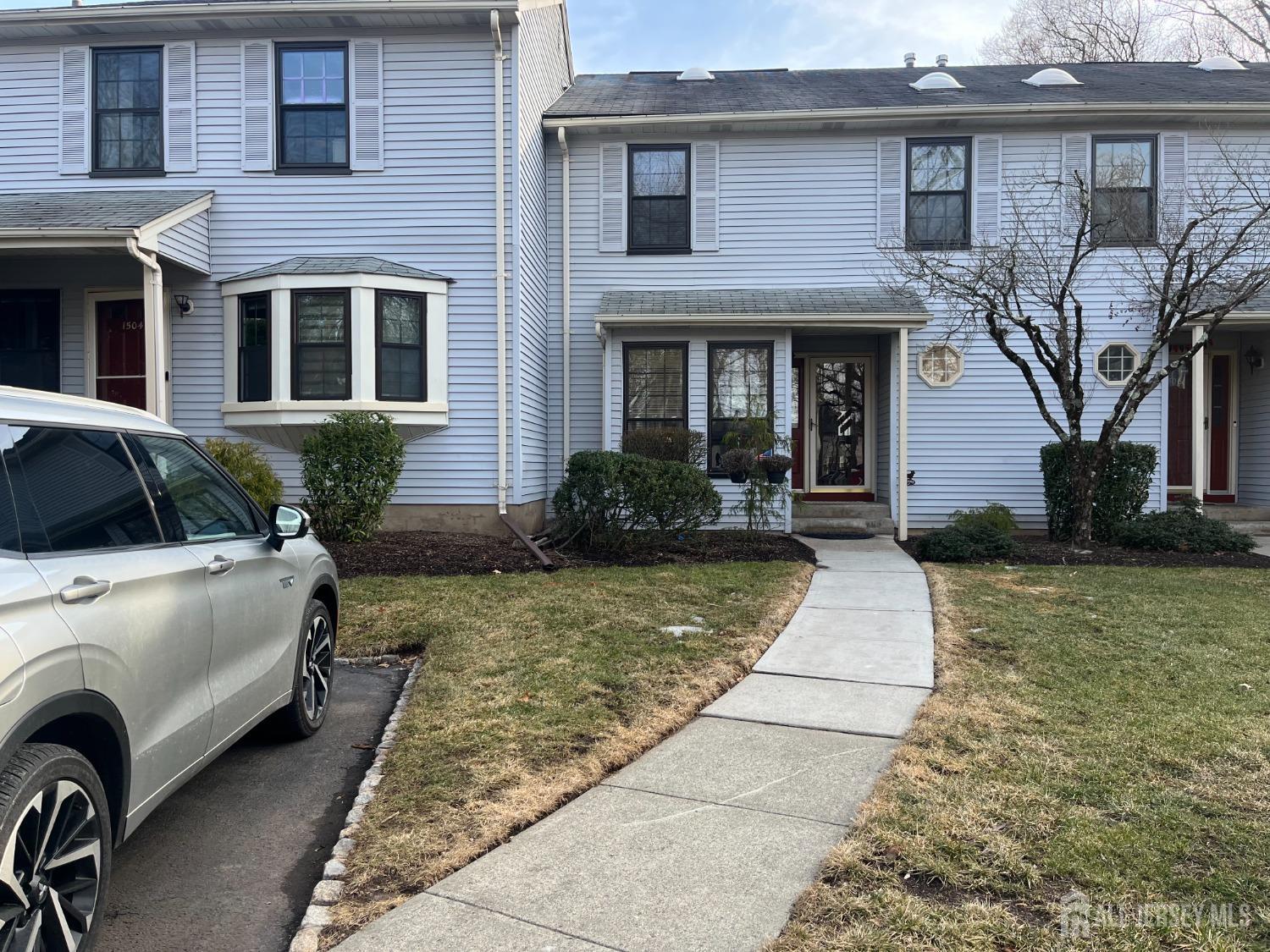 1505 Timber Oaks Road Edison, NJ 08820 - Photo 2 of 27 a front view of a house with garden