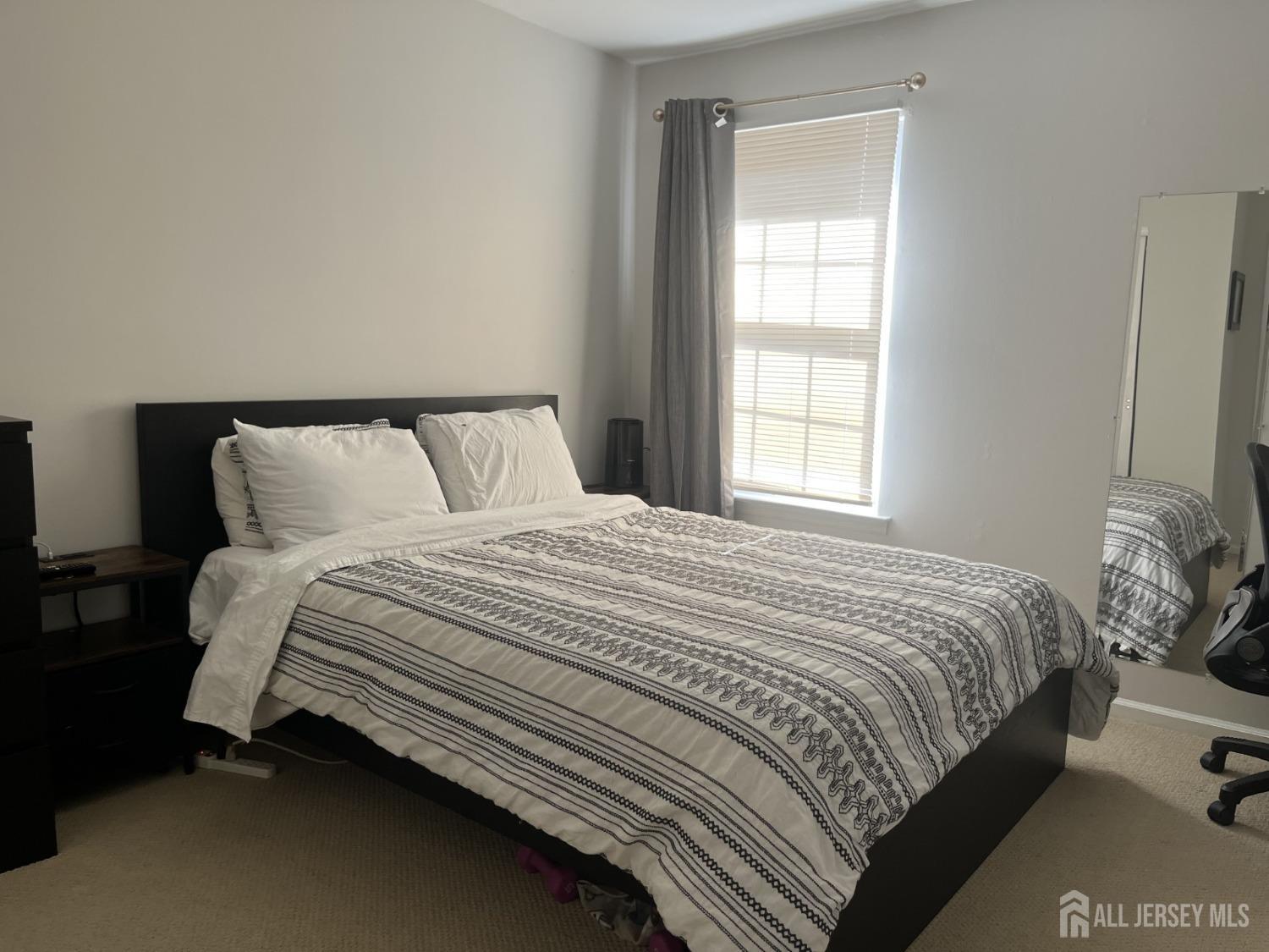 1505 Timber Oaks Road Edison, NJ 08820 - Photo 21 of 27 a bedroom with a bed and window