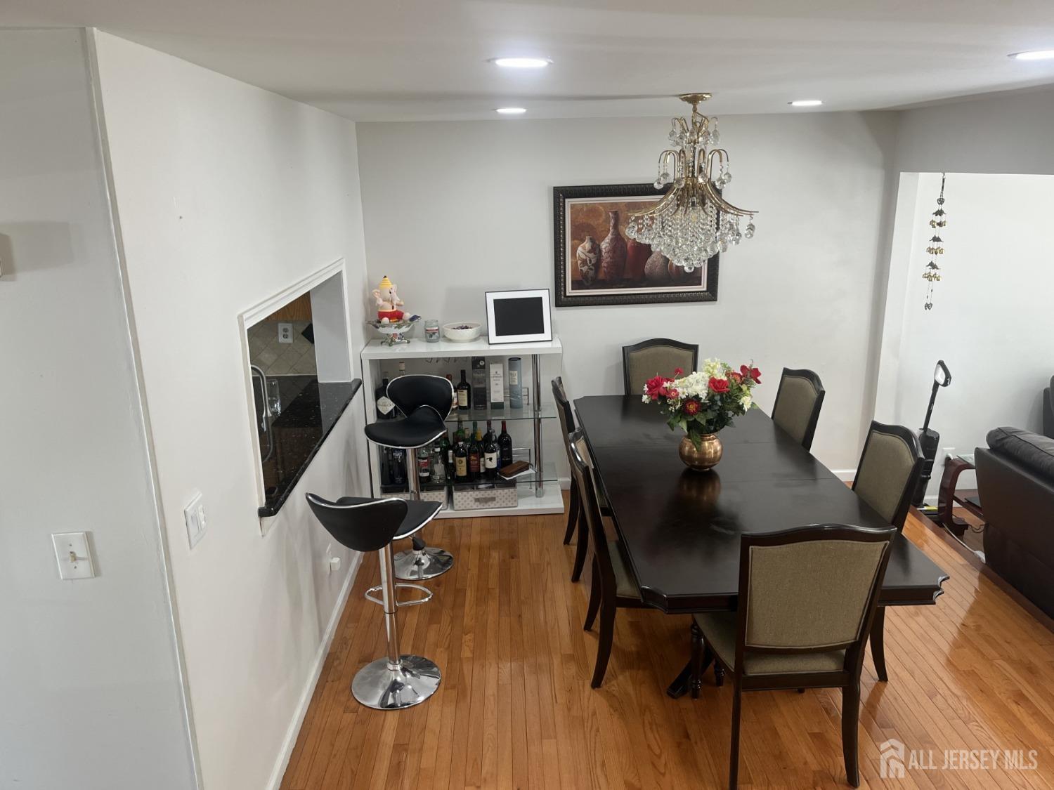 1505 Timber Oaks Road Edison, NJ 08820 - Photo 8 of 27 a view of a dining room with furniture and wooden floor