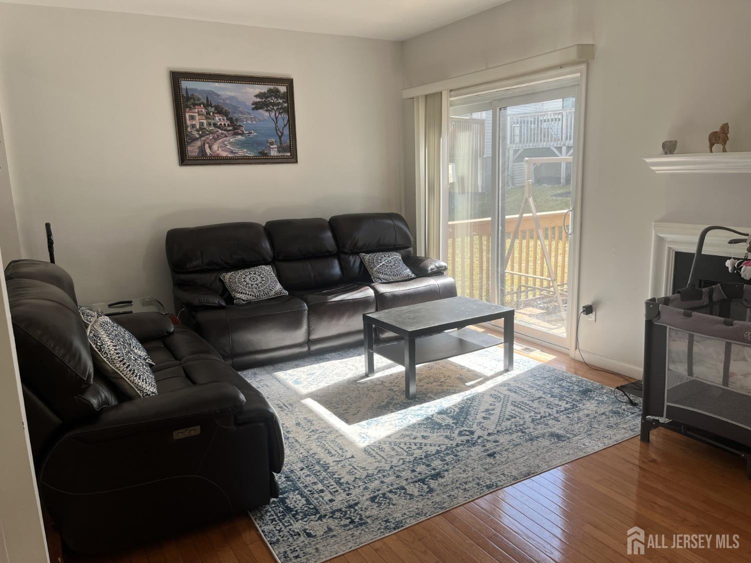 1505 Timber Oaks Road Edison, NJ 08820 - Photo 10 of 27 a living room with furniture and a window