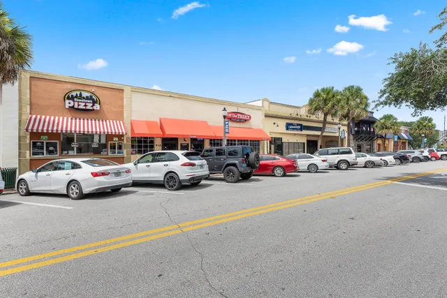 a view of a lake with houses in the back