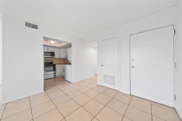 a view of an empty room and window