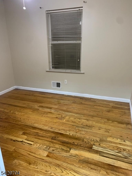 821 Anna Street Elizabeth, NJ 07201 - Photo 5 of 11 a view of a room with wooden floor and a sink