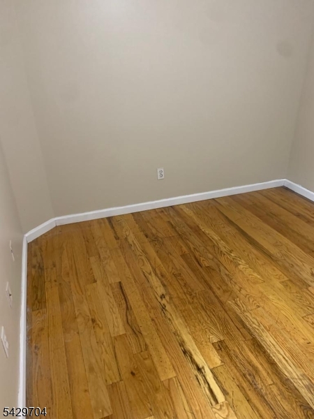 821 Anna Street Elizabeth, NJ 07201 - Photo 6 of 11 a view of wooden floor