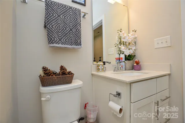 a living room with furniture a flat screen tv and a window