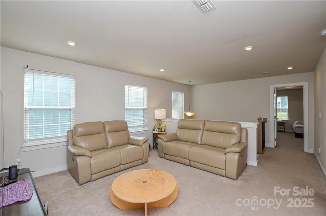 a spacious bathroom with a double vanity sink and a mirror