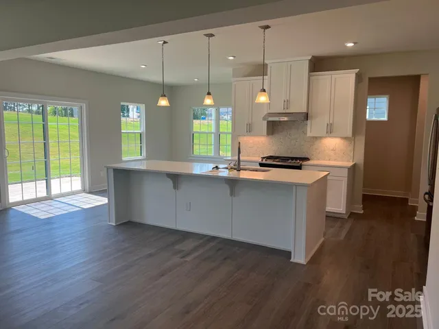 a bathroom with a sink vanity and mirror