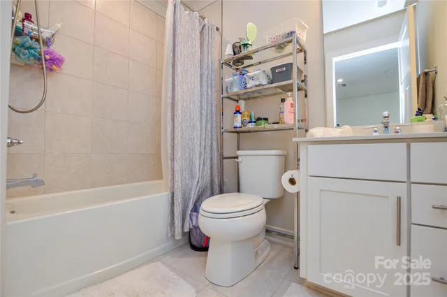 a bedroom with a bed and a lamp