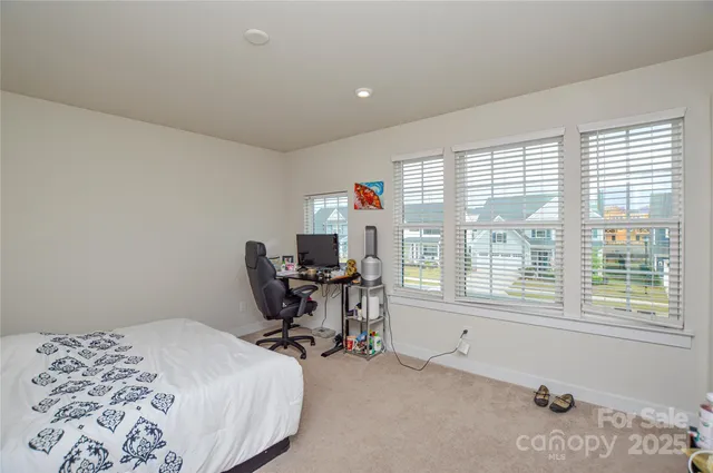 a view of a house with basketball court