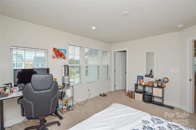 a view of a house with a backyard and sitting area
