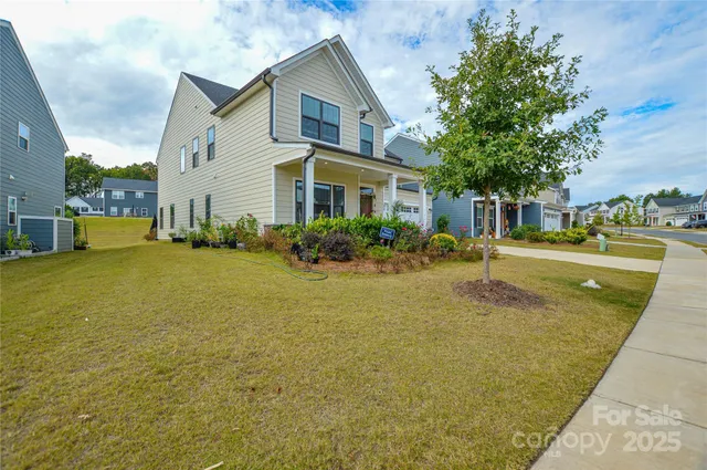 a view of a house with potted plants
