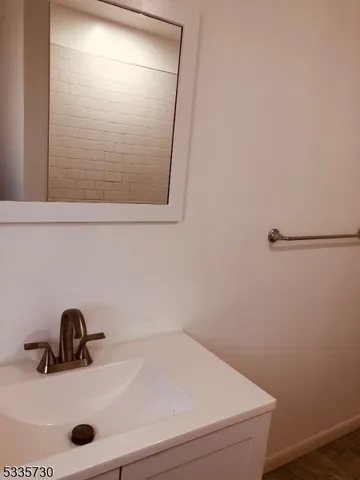 a bathroom with a sink and mirror