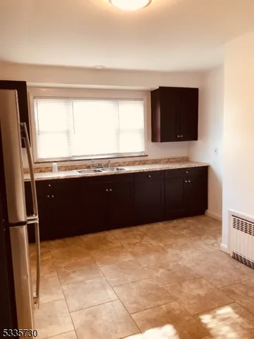 a kitchen with a sink and a bathtub