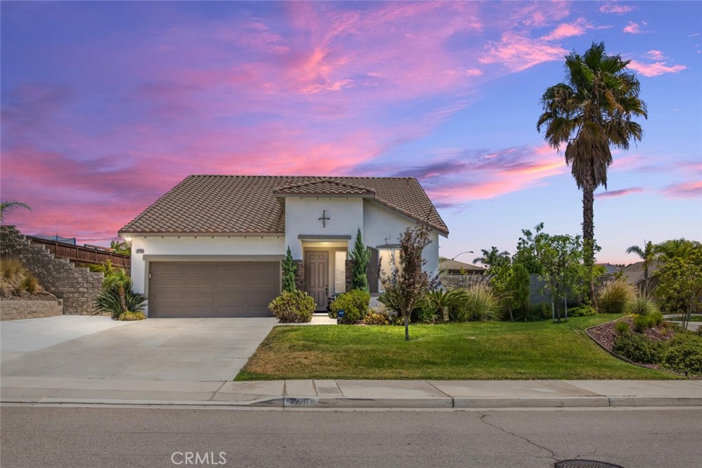 8280 Bakal Drive Riverside, CA 92508 - Photo 1 of 1 a front view of a house with a yard and garage