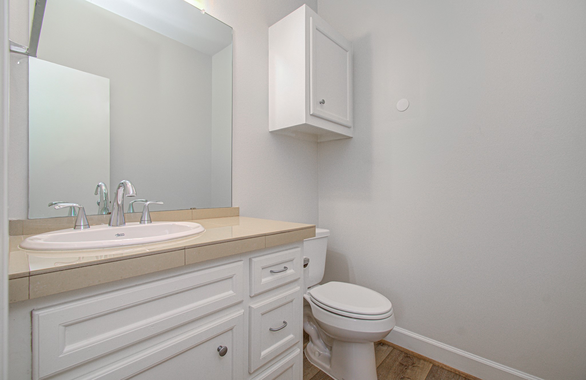 624 East 39th Street Houston, TX 77022 - Photo 19 of 37 a bathroom with a granite countertop toilet and a sink