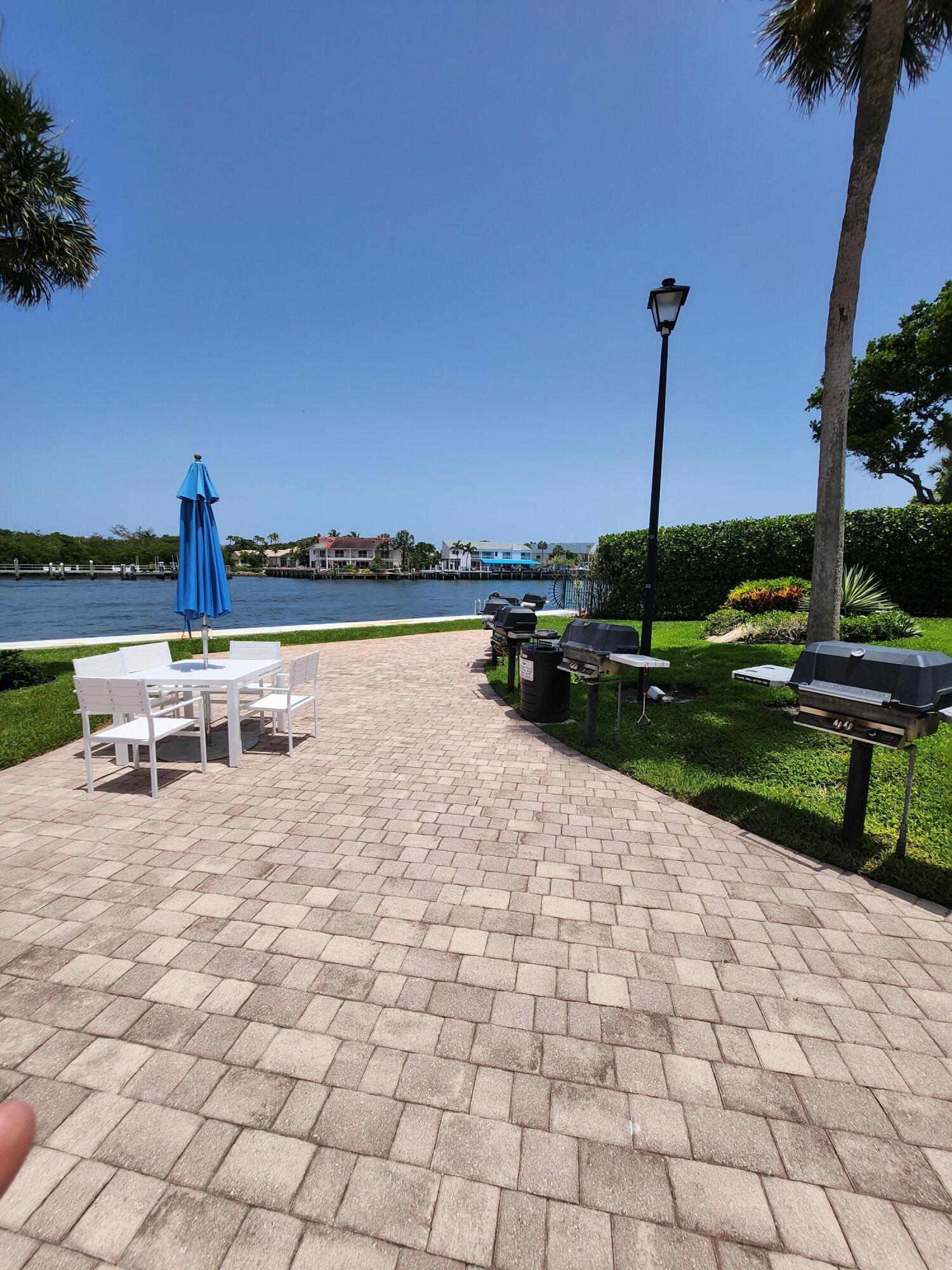 899 Jeffery Street, Unit 601 Boca Raton, FL 33487 - Photo 23 of 47 a view of a terrace with chairs