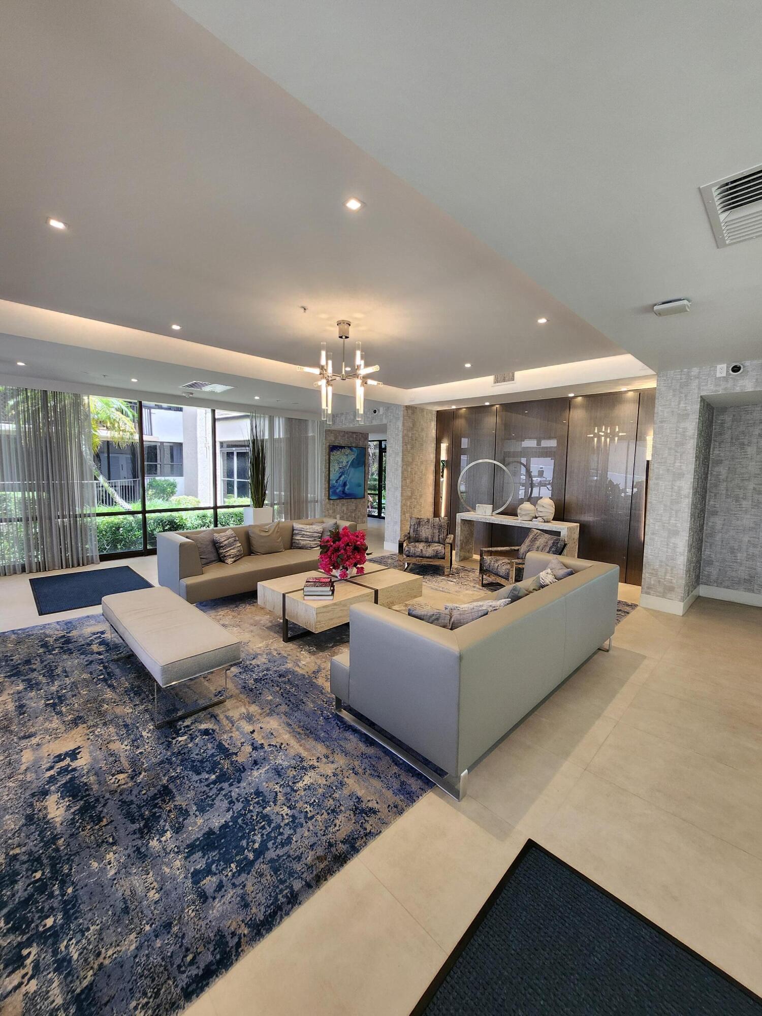 899 Jeffery Street, Unit 601 Boca Raton, FL 33487 - Photo 34 of 47 a living room with furniture and a large window