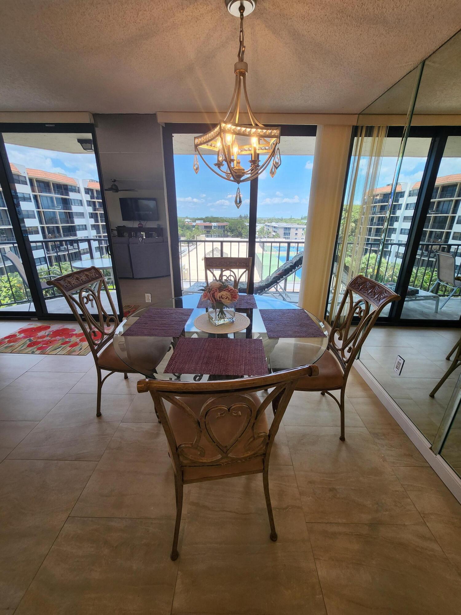 899 Jeffery Street, Unit 601 Boca Raton, FL 33487 - Photo 7 of 47 a view of a dining room with furniture window and outside view