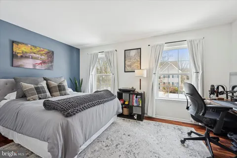a bedroom with bed and a window