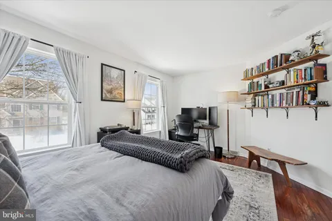 a bedroom with a bed furniture and a window