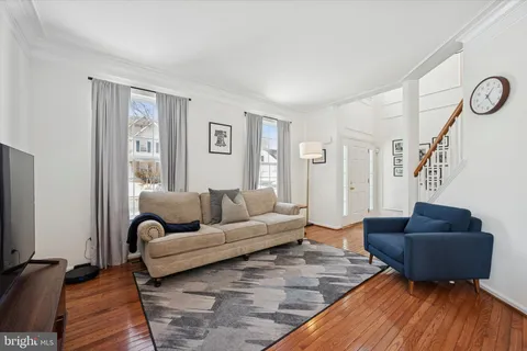 a living room with furniture and a rug