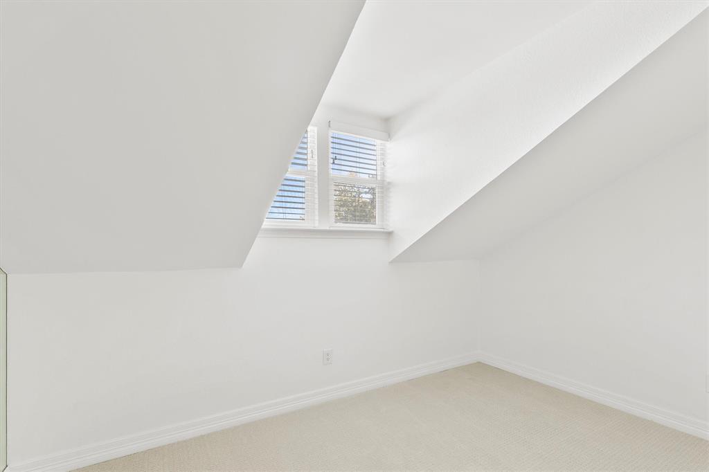 5565 Preston Oaks Road, Unit 136 Dallas, TX 75254 - Photo 23 of 40 a view of a small space with wooden floor and a window