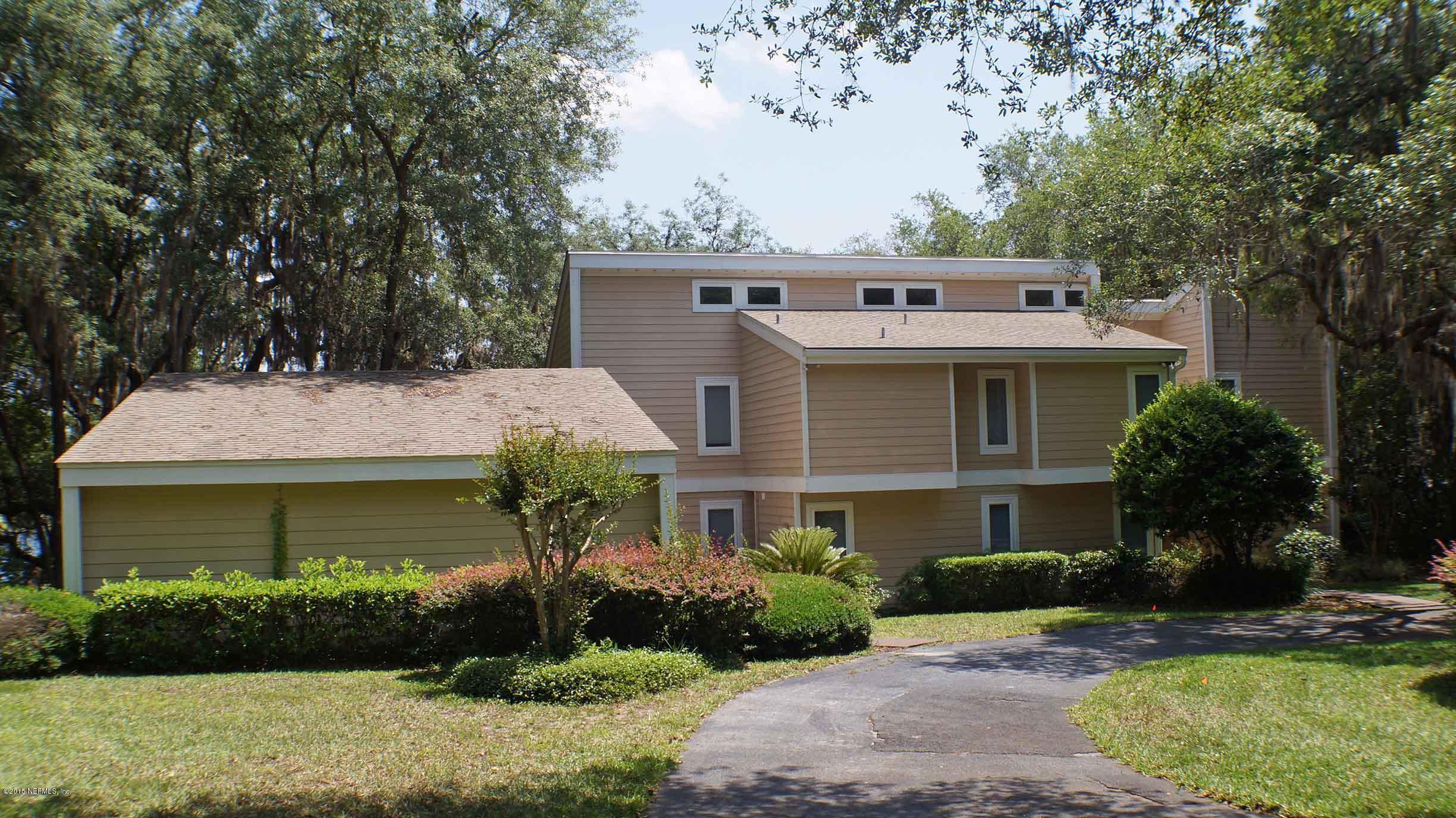 6674 Brooklyn Bay Road Keystone Heights, FL 32656 - Photo 1 of 57 a front view of a house with a garden