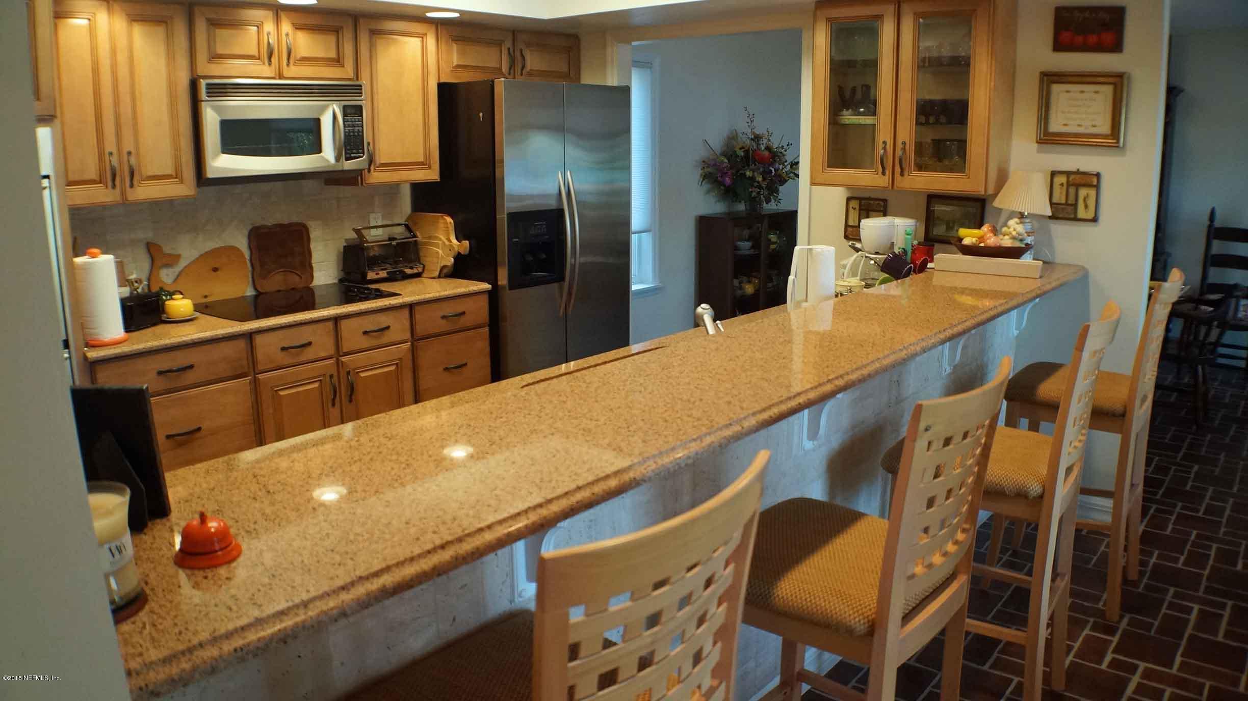 6674 Brooklyn Bay Road Keystone Heights, FL 32656 - Photo 12 of 57 a kitchen with stainless steel appliances a sink a stove and a refrigerator
