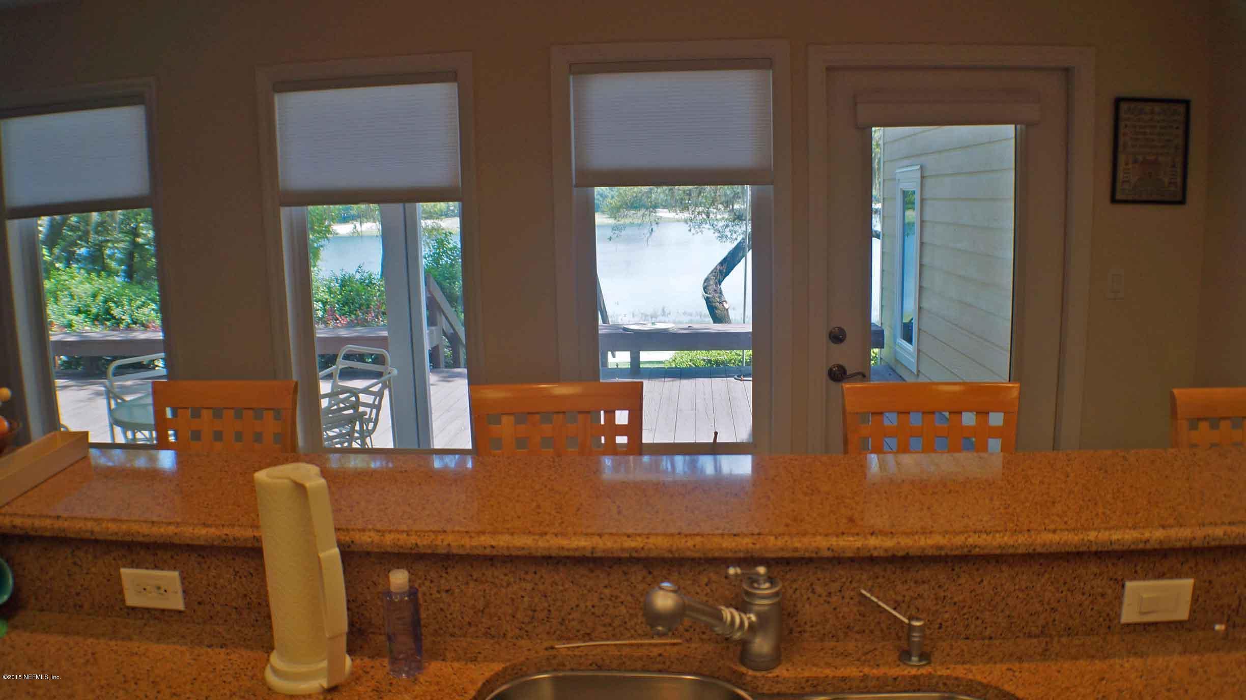 6674 Brooklyn Bay Road Keystone Heights, FL 32656 - Photo 15 of 57 a dining room with furniture and window