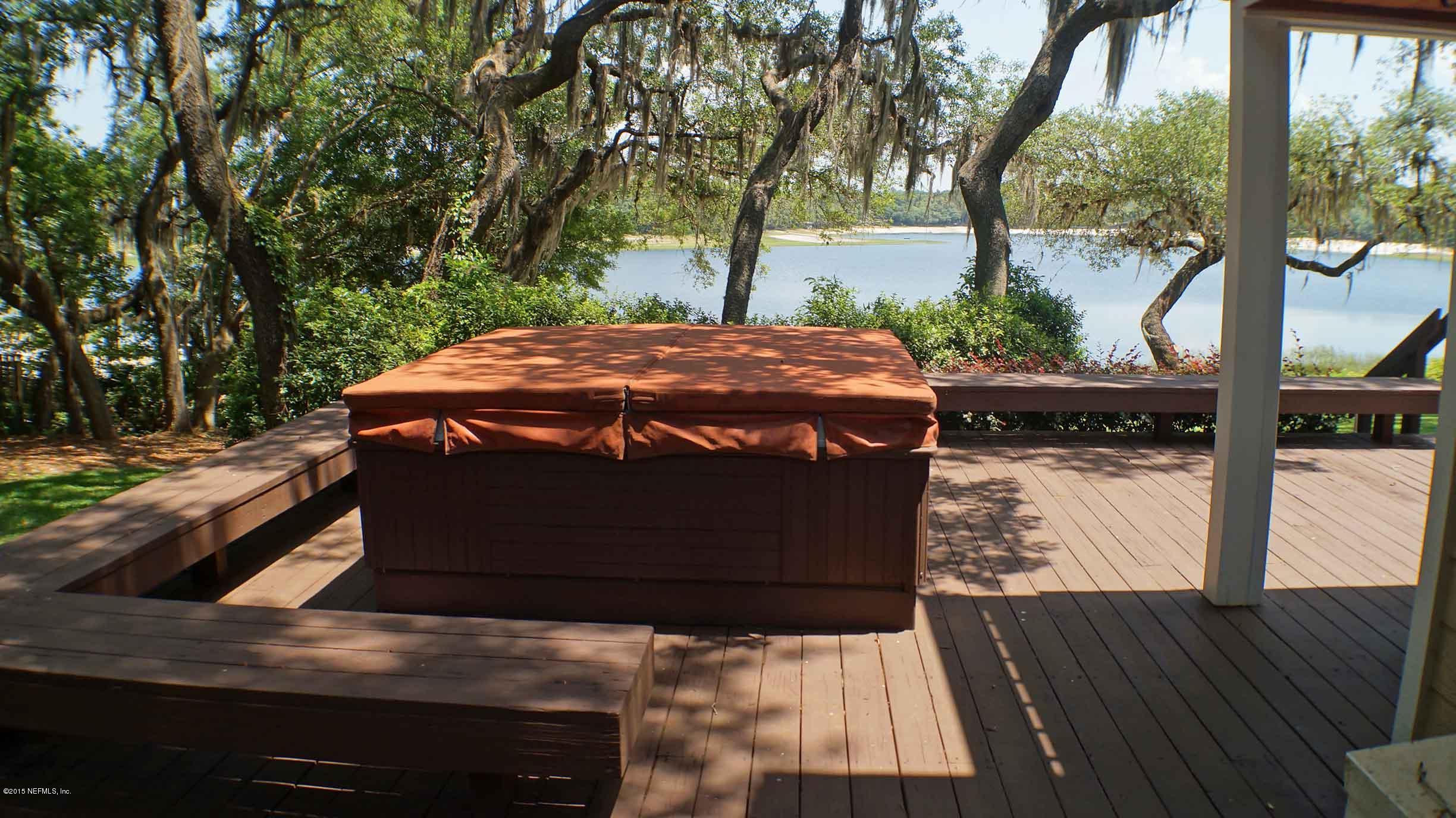 6674 Brooklyn Bay Road Keystone Heights, FL 32656 - Photo 23 of 57 a view of a backyard with a deck