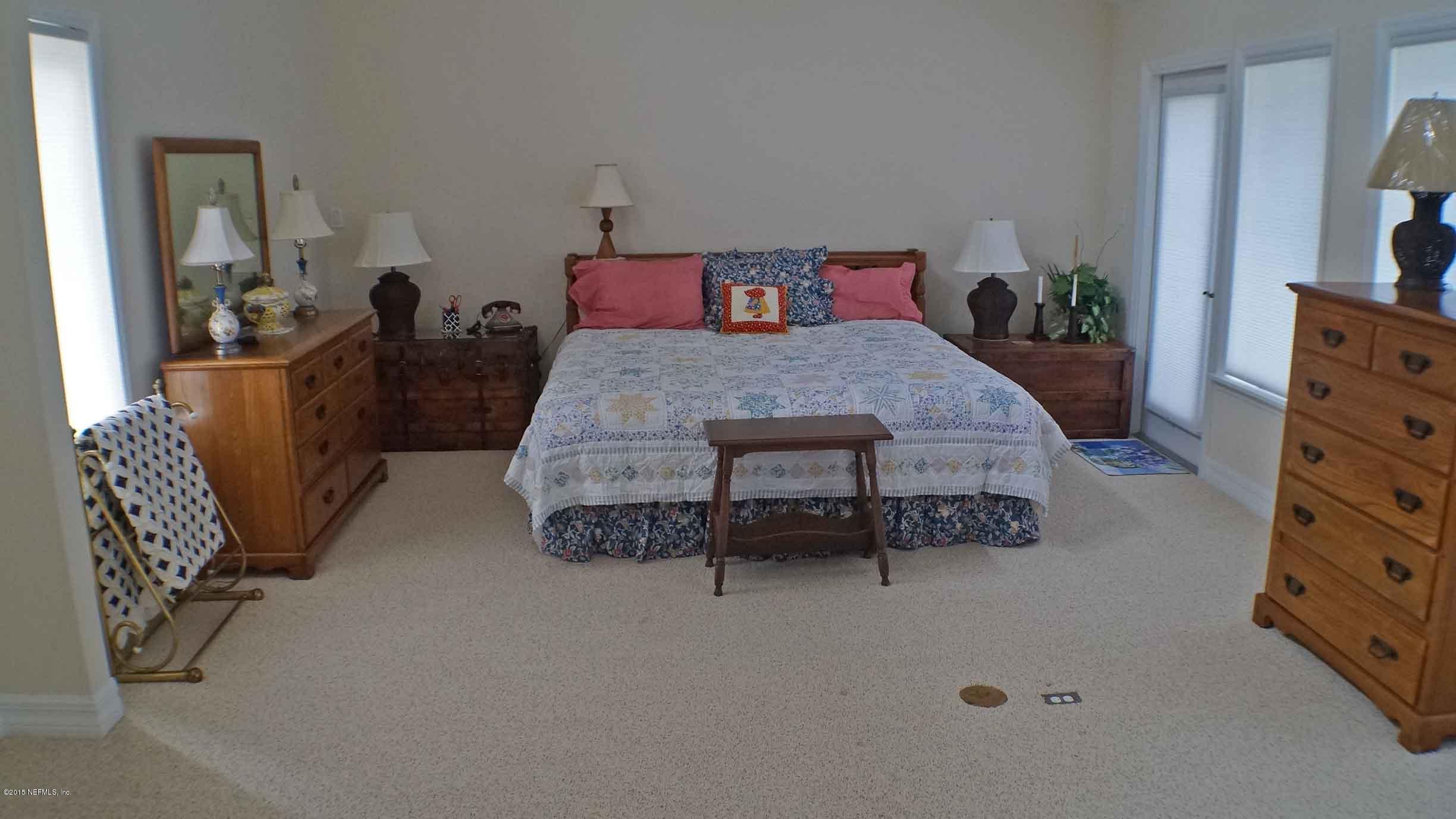 6674 Brooklyn Bay Road Keystone Heights, FL 32656 - Photo 31 of 57 a living room with furniture and a dresser